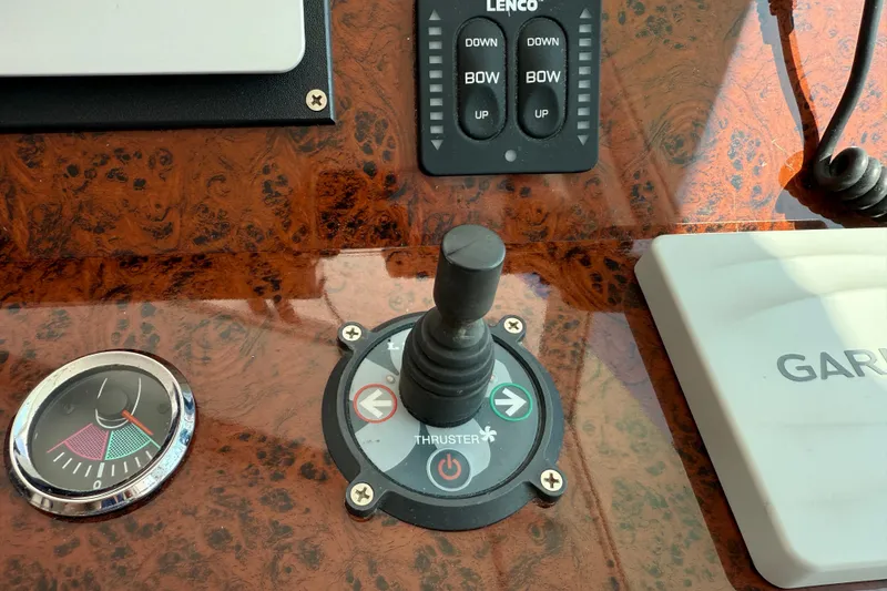 Slide: The Image of Control panel of a 2007 Beneteau Swift Trawler 42 with joystick and gauges. - 89