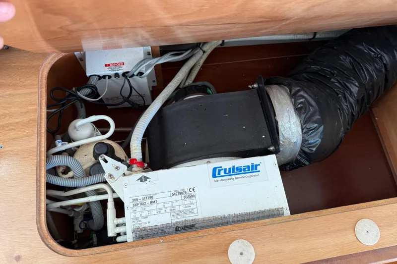 Slide: The Image of Cruisair air conditioning unit in 2007 Beneteau Swift Trawler 42 engine compartment. - 92