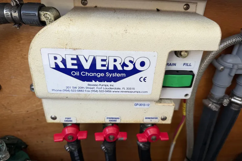 Slide: The Image of Reverso oil change system on 2007 Beneteau Swift Trawler 42, featuring drain and fill controls. - 93