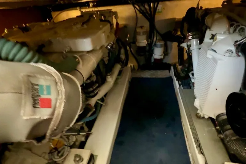 Slide: The Image of Engine room of a 2007 Beneteau Swift Trawler 42, showcasing mechanical components. - 97