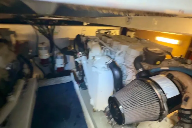 Slide: The Image of Engine room of 2007 Beneteau Swift Trawler 42, showcasing mechanical components. - 98