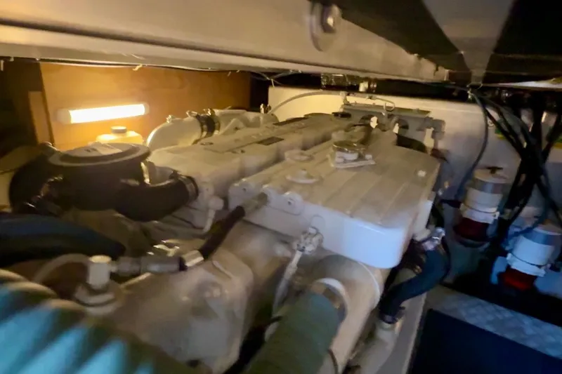Slide: The Image of Engine room of 2007 Beneteau Swift Trawler 42, showcasing mechanical components. - 99