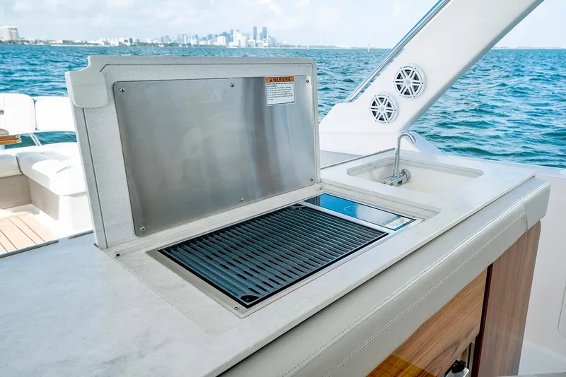 Slide: The Image of Manufacturer Provided Image: 2023 Tiara Yachts 43 LS outdoor kitchen with grill and sink. - 13