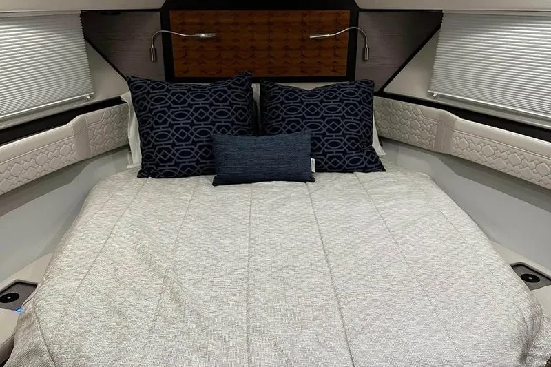 Slide: The Image of Luxurious 2023 Tiara Yachts 43 LS cabin interior with elegant bedding and pillows. - 27