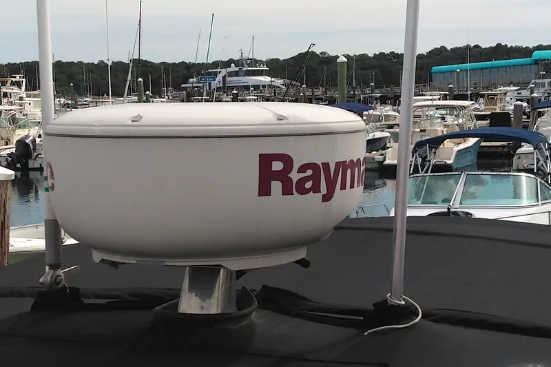 Slide: The Image of Radar system on a 2008 Cobalt 323 boat docked at a marina. - 23