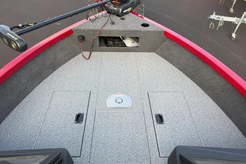 Slide: The Image of 2026 Crestliner 1750 HAWK WT boat deck with storage compartments and trolling motor. - 10