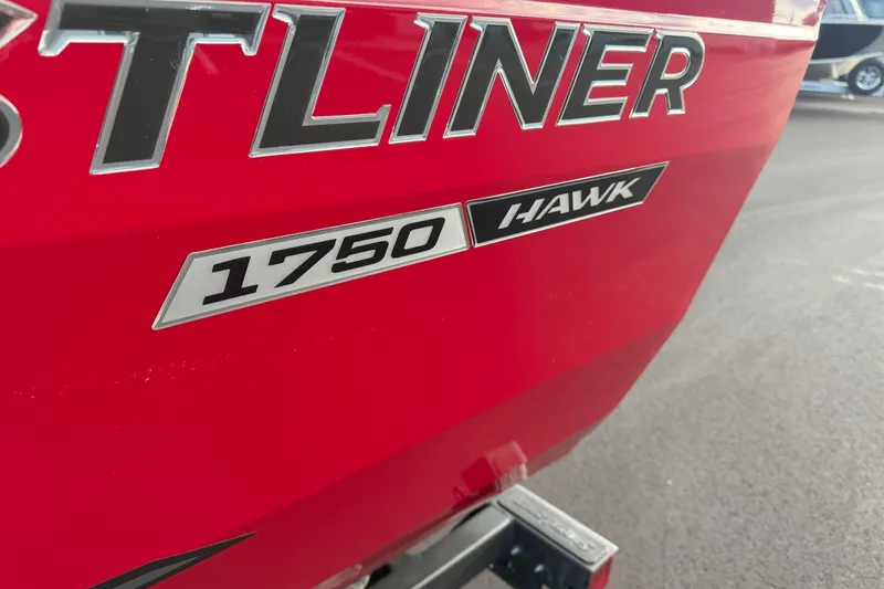 Slide: The Image of Red 2026 Crestliner 1750 HAWK WT boat with bold lettering. - 14