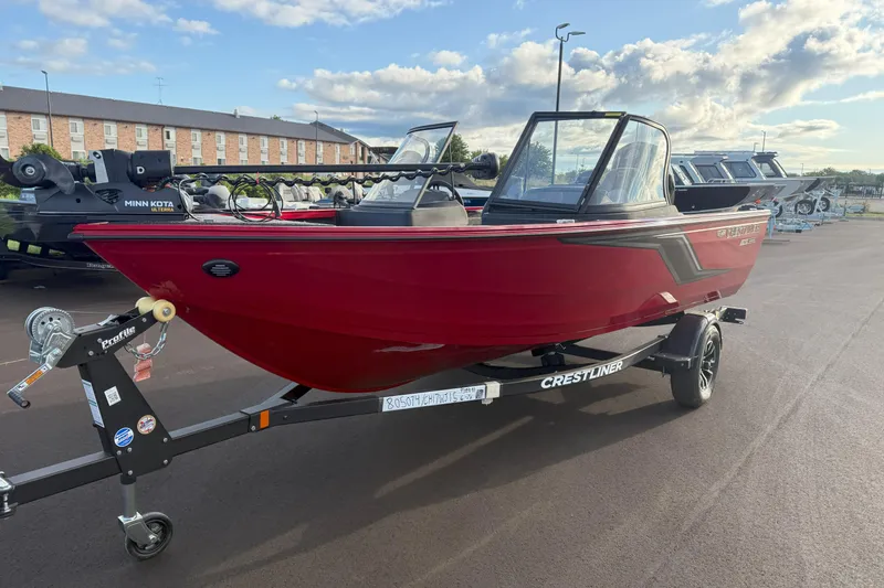 Slide: The Image of 2026 Crestliner 1750 HAWK WT boat in vibrant red on a trailer. - 3