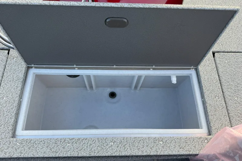 Slide: The Image of 2026 Crestliner 1750 HAWK WT livewell, open lid, gray interior, boat storage compartment. - 6