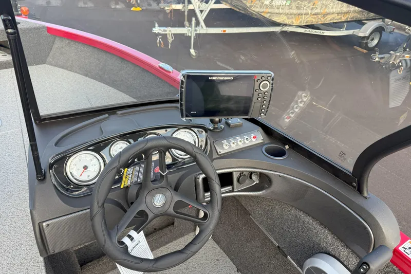 Slide: The Image of 2026 Crestliner 1750 HAWK WT boat dashboard with steering wheel and navigation system. - 8