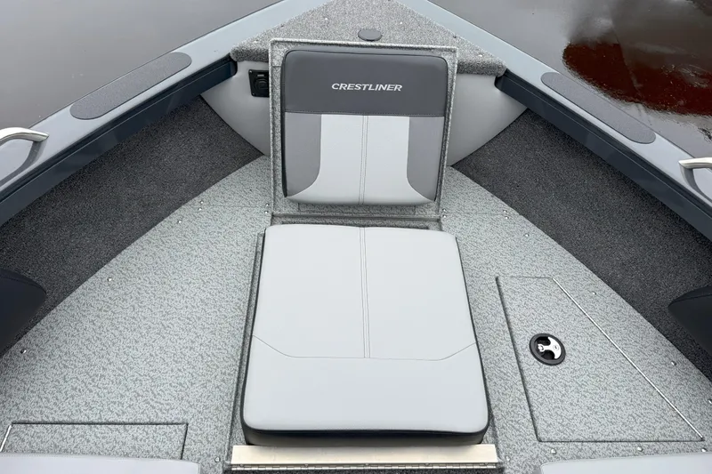 Slide: The Image of 2026 Crestliner 1950 Sportfish boat interior with gray seating and carpeted flooring. - 11