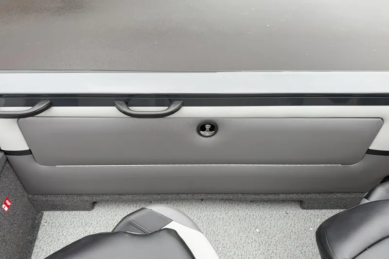 Slide: The Image of 2026 Crestliner 1950 Sportfish interior, featuring sleek seating and storage compartment. - 13