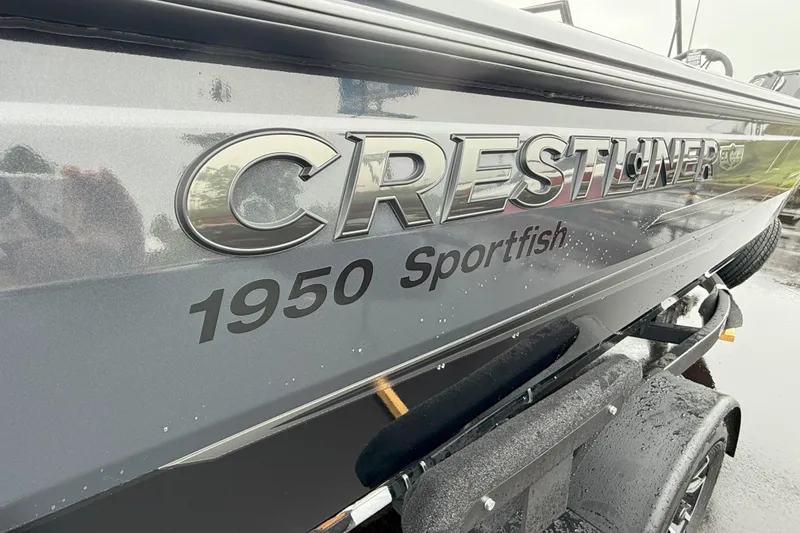 Slide: The Image of 2026 Crestliner 1950 Sportfish boat, sleek design with metallic finish. - 15