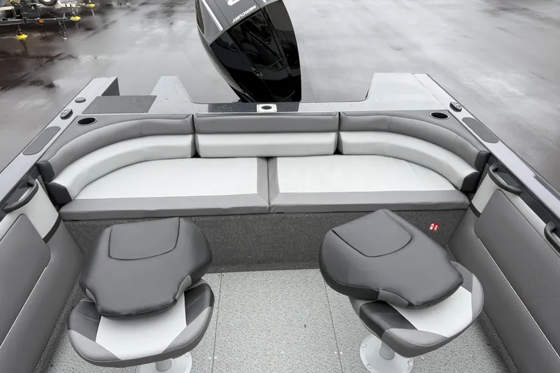 Slide: The Image of 2026 Crestliner 1950 Sportfish boat interior with cushioned seating and swivel chairs. - 5
