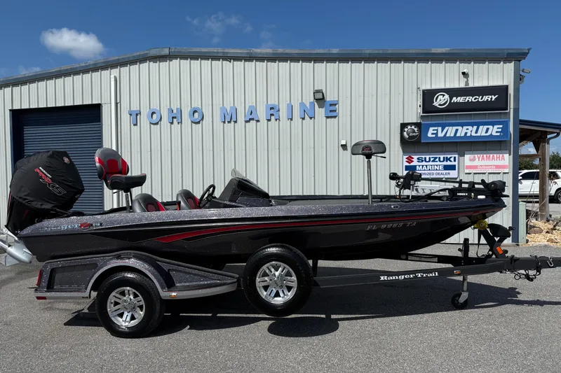 The Image of 2021 Ranger Z518 boat at Toho Marine dealership, featuring sleek design and trailer. - 1