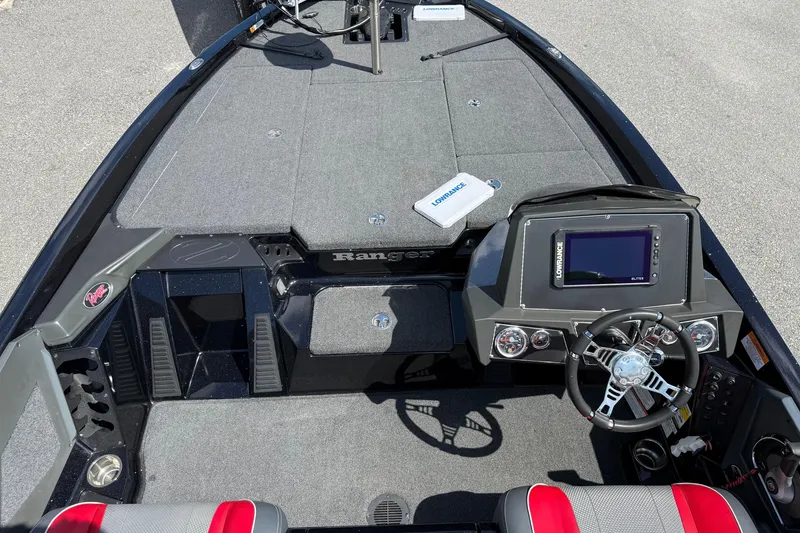 Slide: The Image of 2021 Ranger Z518 boat interior with steering wheel and navigation system. - 16