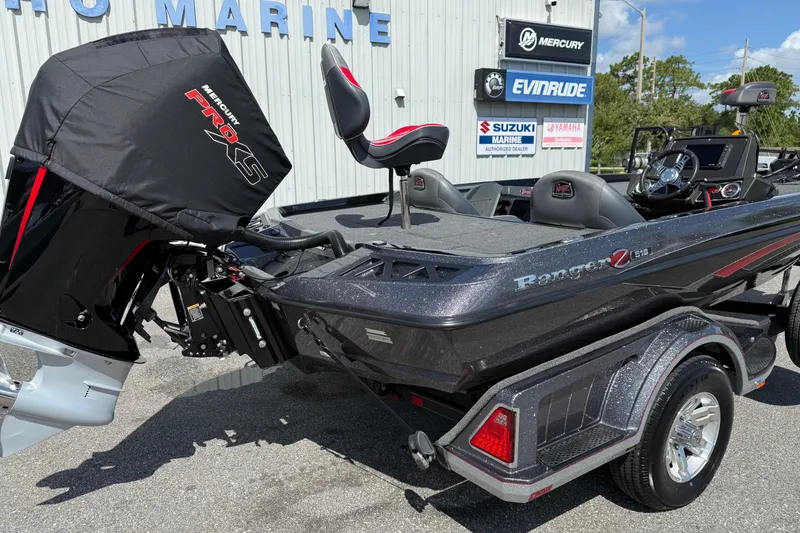 Slide: The Image of 2021 Ranger Z518 boat with Mercury Pro XS engine at a marine dealership. - 18