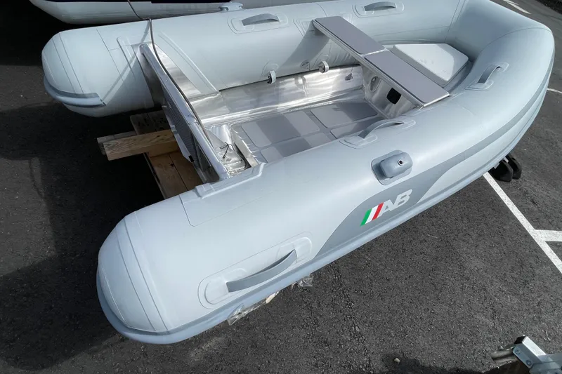 Slide: The Image of 2025 AB Inflatables Lammina 8 AL boat, gray, parked on asphalt. - 3