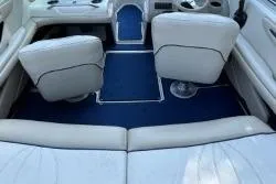 Slide: The Image of 1998 Sea Ray 190 Bow Rider interior with white seats and blue carpet. - 5