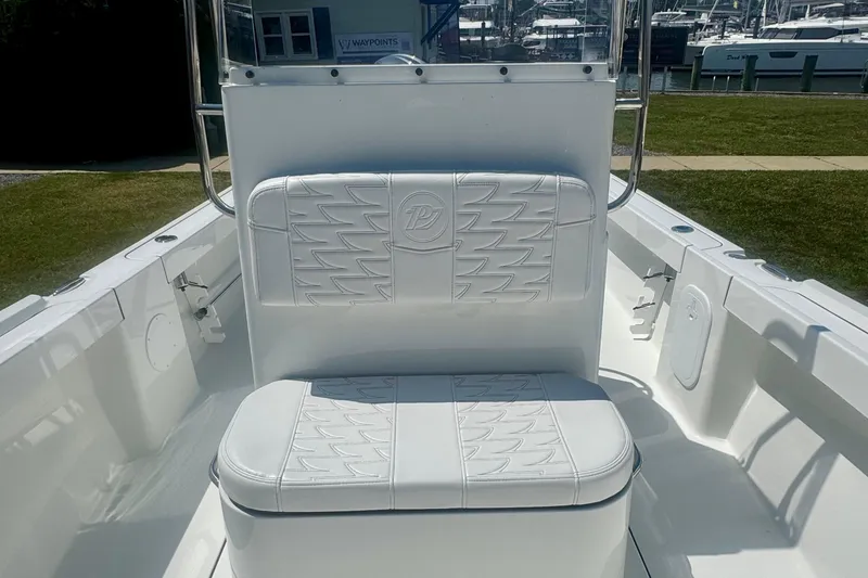 Slide: The Image of 2026 Parker 18SE Center Console boat interior with white cushioned seating. - 10