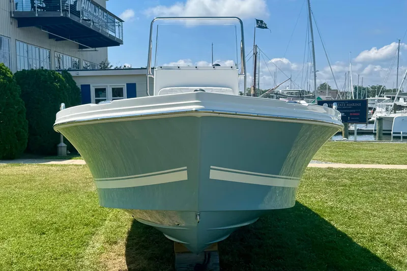 Slide: The Image of 2026 Parker 18SE Center Console boat displayed outdoors near marina. - 3