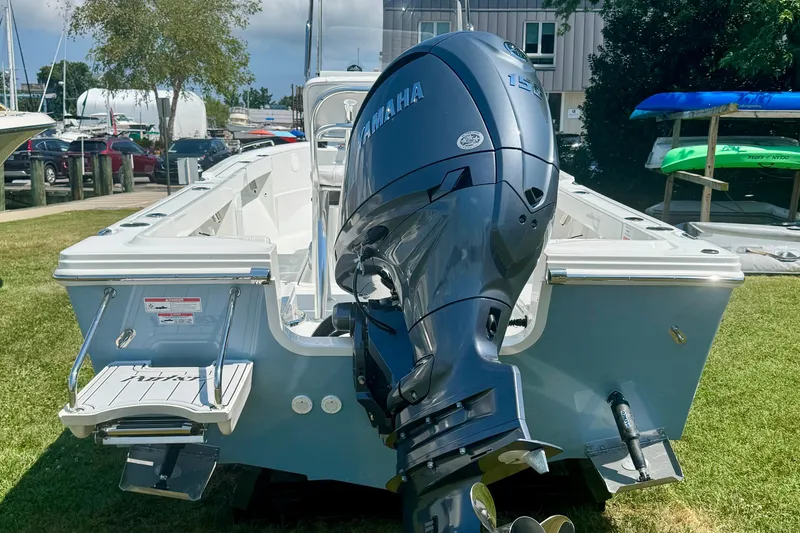 Slide: The Image of 2026 Parker 18SE Center Console boat with Yamaha outboard motor, displayed outdoors. - 4