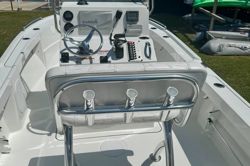 Slide: The Image of 2026 Parker 18SE Center Console boat interior with steering wheel and Garmin navigation system. - 5