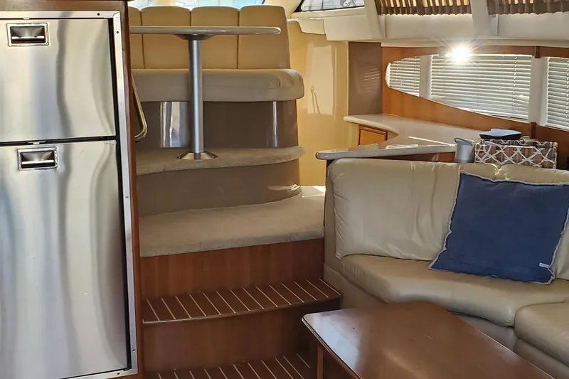 Slide: The Image of Interior of 2002 Carver 410 Sport Sedan with modern seating and stainless steel appliances. - 22