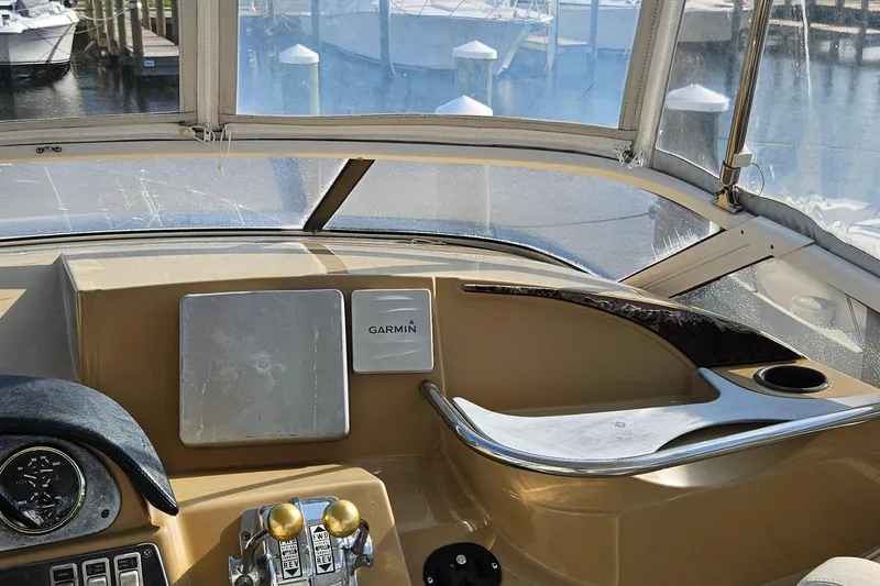 Slide: The Image of Interior view of 2002 Carver 410 Sport Sedan boat cockpit with Garmin navigation system. - 7