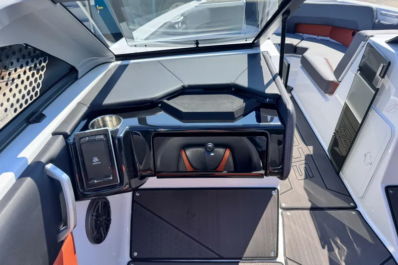 Slide: The Image of Interior of 2026 Scarab 235 LX Wake boat, featuring sleek design and modern amenities. - 16