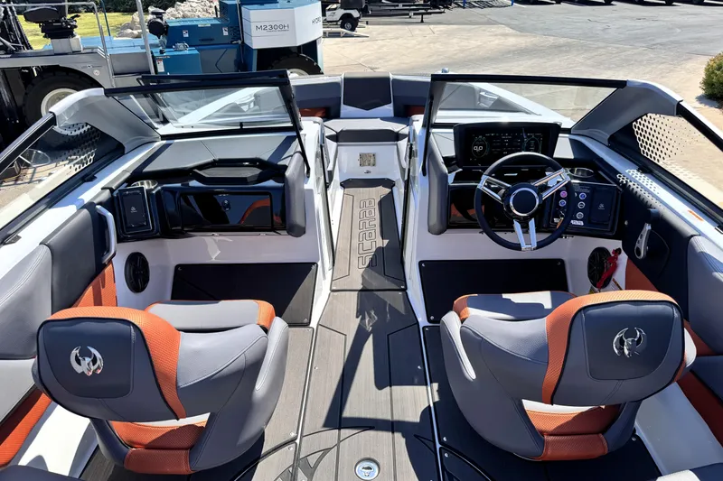 Slide: The Image of Interior of 2026 Scarab 235 LX Wake boat, featuring modern dashboard and seating. - 18