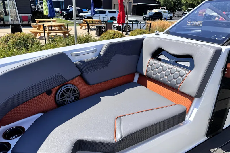 Slide: The Image of Interior of 2026 Scarab 235 LX Wake boat with stylish seating and speaker system. - 21