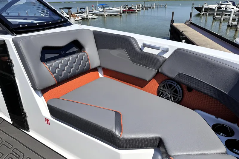 Slide: The Image of Luxurious seating on 2026 Scarab 235 LX Wake boat, featuring modern design and waterfront view. - 22