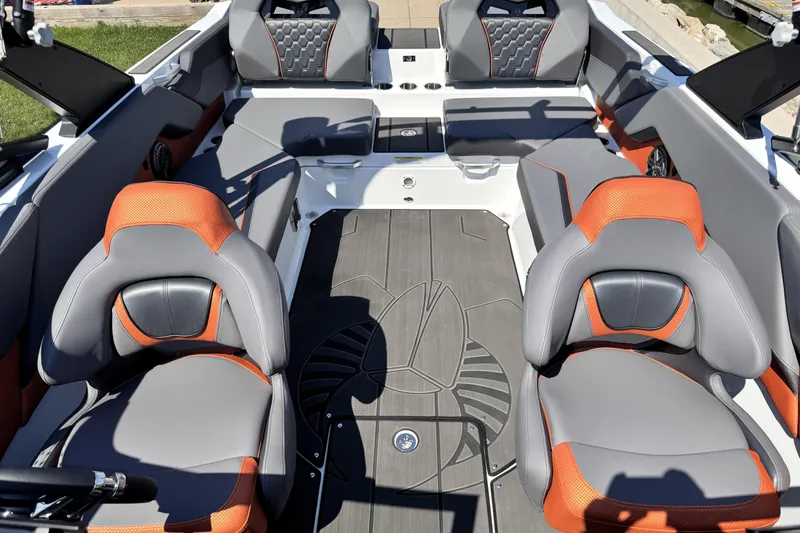 Slide: The Image of 2026 Scarab 235 LX Wake boat interior with gray and orange seating, modern design. - 23
