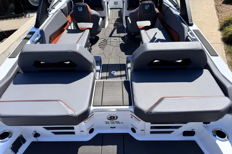 Slide: The Image of 2026 Scarab 235 LX Wake boat interior with stylish seating and modern design. - 9