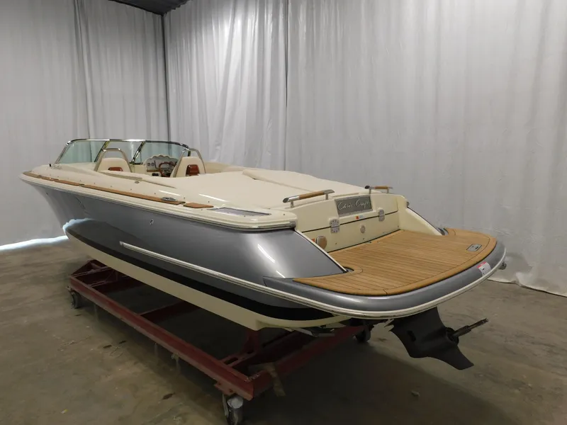Slide: The Image of 2021 Chris-Craft Launch 27 boat with sleek design in indoor storage. - 16