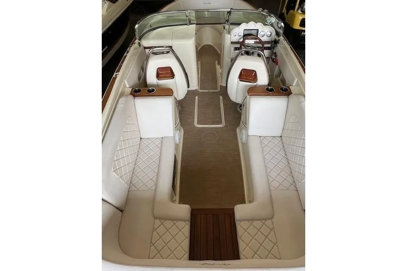 Slide: The Image of 2021 Chris-Craft Launch 27 interior with elegant seating and wooden accents. - 7