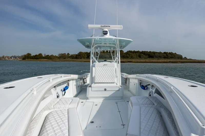 Slide: The Image of 2025 Yellowfin 34 Offshore boat on calm water, featuring sleek design and advanced navigation. - 24