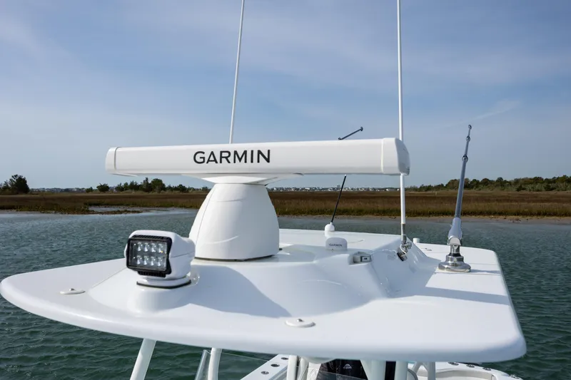 Slide: The Image of 2025 Yellowfin 34 Offshore boat with Garmin radar on open water. - 28