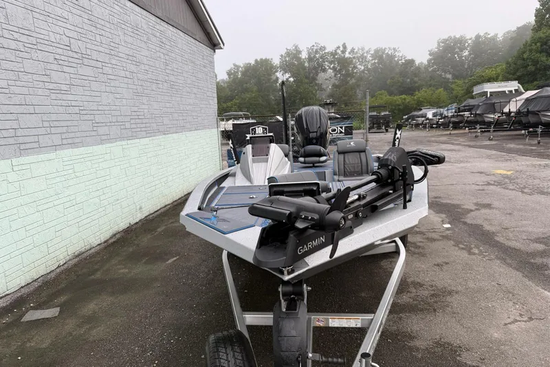 Slide: The Image of 2026 Xpress X19 Pro boat with Garmin equipment, parked outdoors on a trailer. - 3