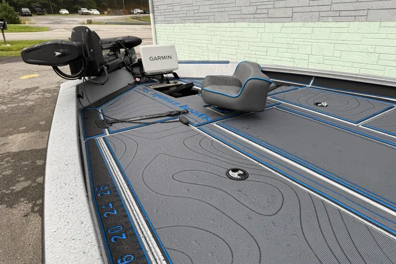 Slide: The Image of 2026 Xpress X19 Pro boat deck with Garmin equipment and seating. - 4