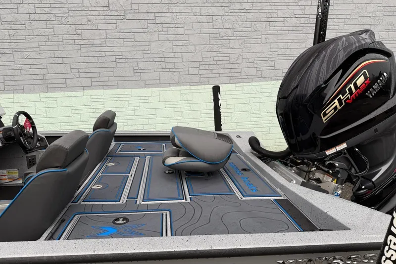 Slide: The Image of 2026 Xpress X19 Pro boat interior with Yamaha SHO VMAX engine, gray and blue seating. - 5