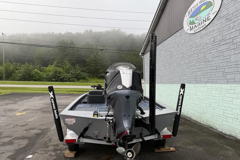 Slide: The Image of 2026 Xpress X19 Pro boat with powerful engine, parked near Water Works Marine. - 8
