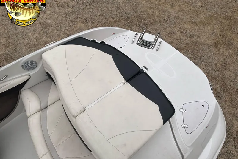 Slide: The Image of 2011 Tahoe Q7i boat interior with white seating and swim platform. - 30