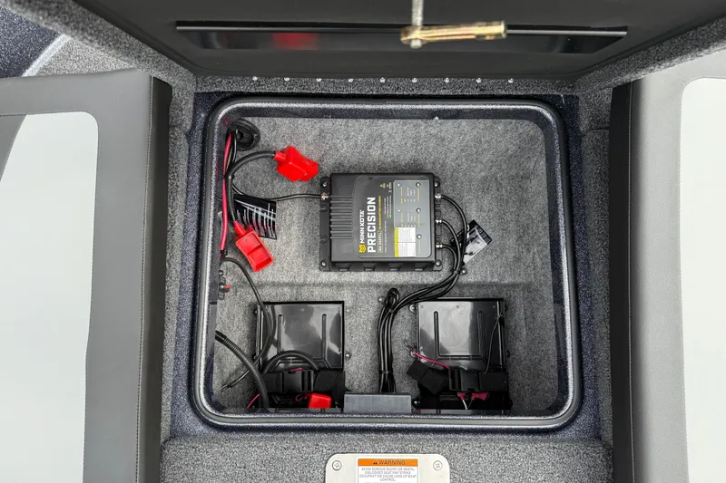 Slide: The Image of 2026 Lund 189 Tyee GL boat interior with storage compartment and seating. - 14