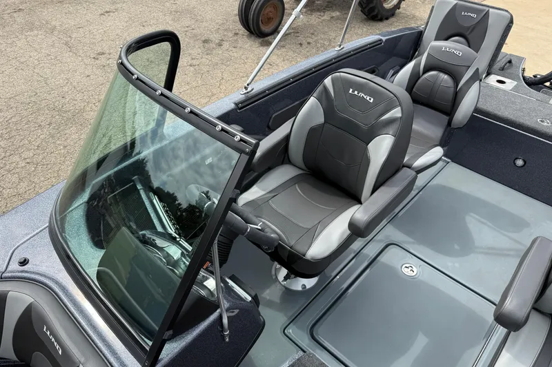 Slide: The Image of 2026 Lund 189 Tyee GL boat interior with four seats and windshield. - 17