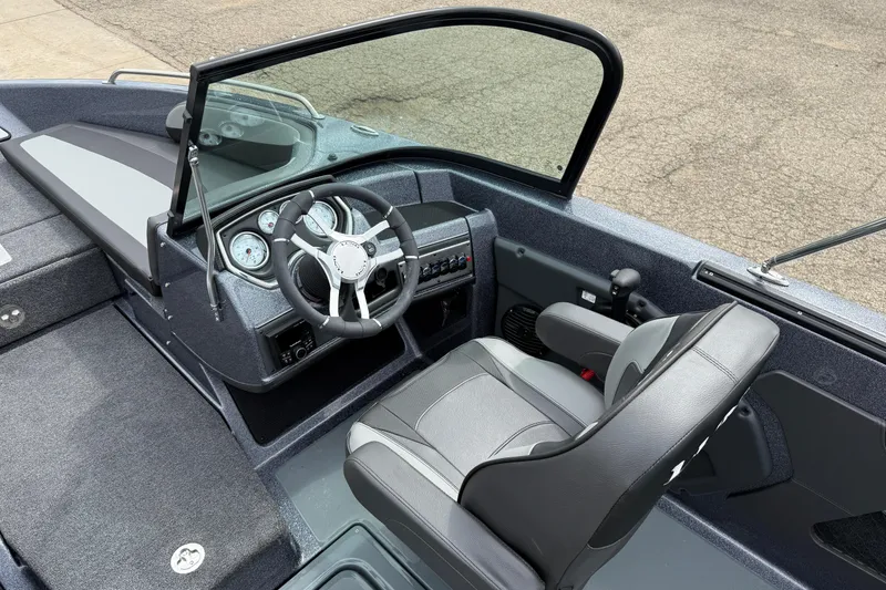 Slide: The Image of 2026 Lund 189 Tyee GL boat interior with comfortable seating and windshield. - 18