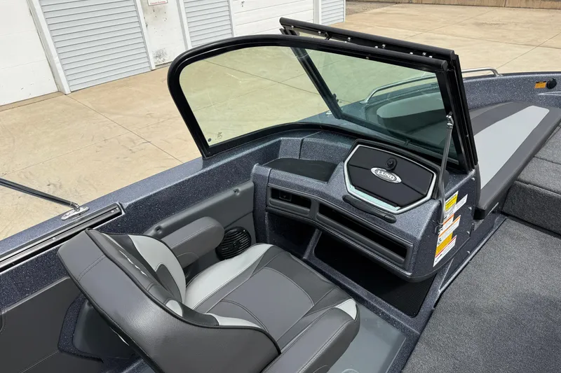 Slide: The Image of 2026 Lund 189 Tyee GL boat interior with steering wheel and dashboard. - 20