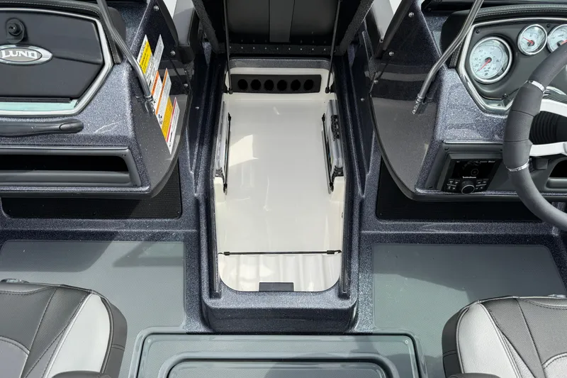 Slide: The Image of Interior view of 2026 Lund 189 Tyee GL boat, featuring sleek dashboard and seating. - 23