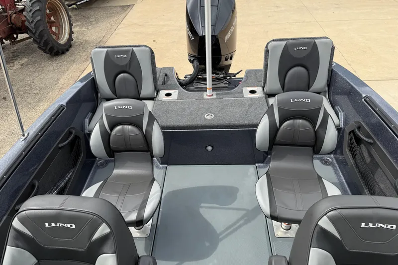 Slide: The Image of 2026 Lund 189 Tyee GL boat interior, featuring dashboard and seating area. - 25